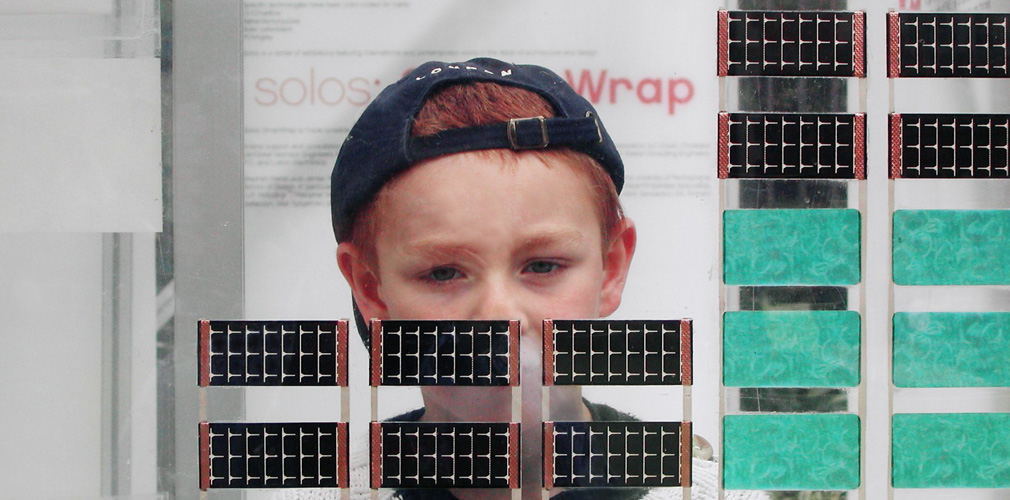 <p>The first SmartWrap&trade; prototype included one layer of PET with thin-film batteries, thin-film PVs and OLEDs adhered and a second layer of PET with PCMs and aerogel insulation.</p>